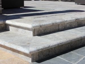 Silver Travertine 16X24 Hon / UF / Tumbled / One Long Side Bull Nose